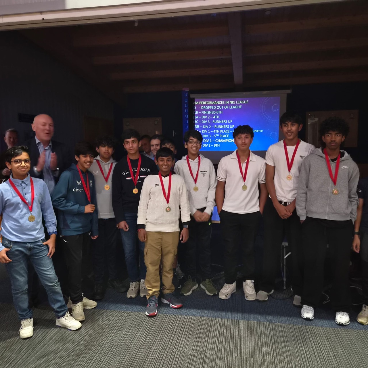 Junior players celebrating their achievements with medals at Dartford Cricket Club’s 2026 presentation evening.